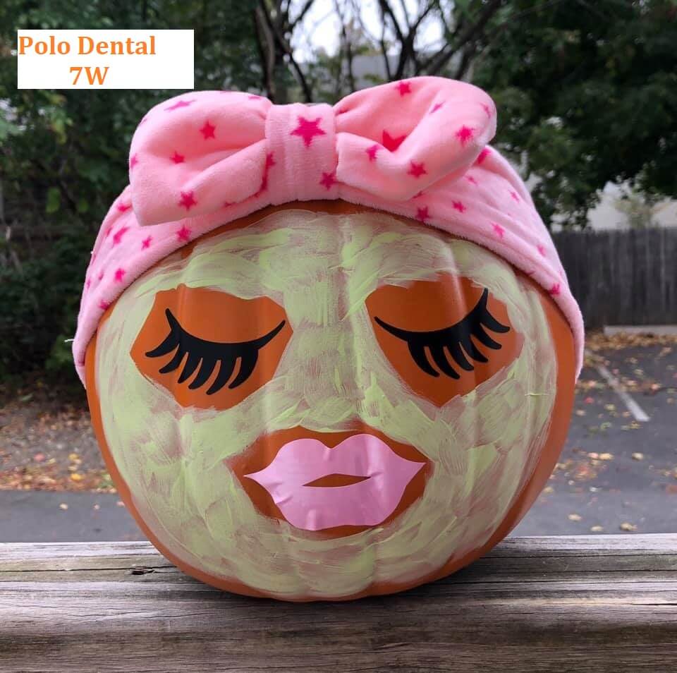 Pumpkin decorated to look like a relaxing person wearing a moisturizing face mask